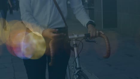 Animation-of-shapes-moving-over-biracial-woman-using-smartphone-and-walking-with-bicycle