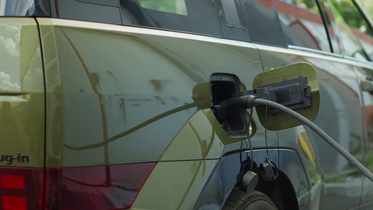 Close Up Of Electric Car Recharging, Concept Of Transition To Zero Emissions