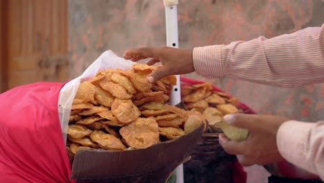 man making the papdi chaat recipe closeup view