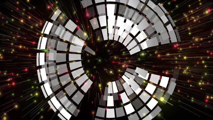 Visualizzazione dati animata nella scena, con anelli segmentati concentrici e particelle luminose.