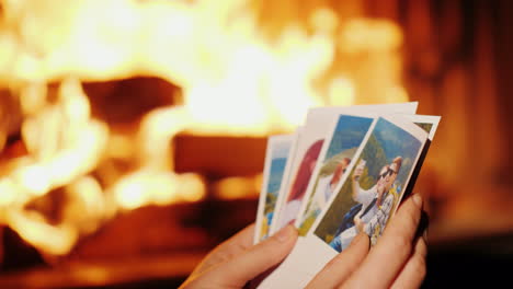 woman looking at photos from vacation in the photo a young couple is resting in the mountains in the