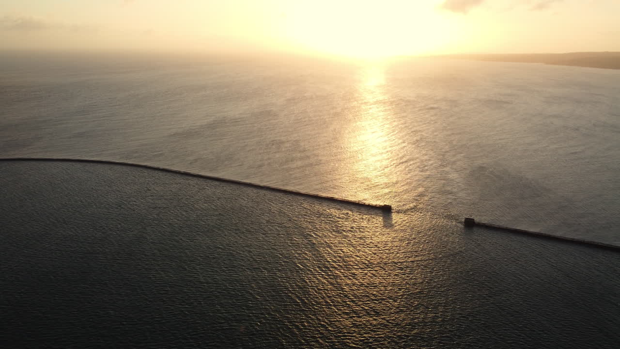 Sunset over the Ocean with Breakwater