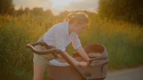 close-up of woman pushing baby stroller outdoors