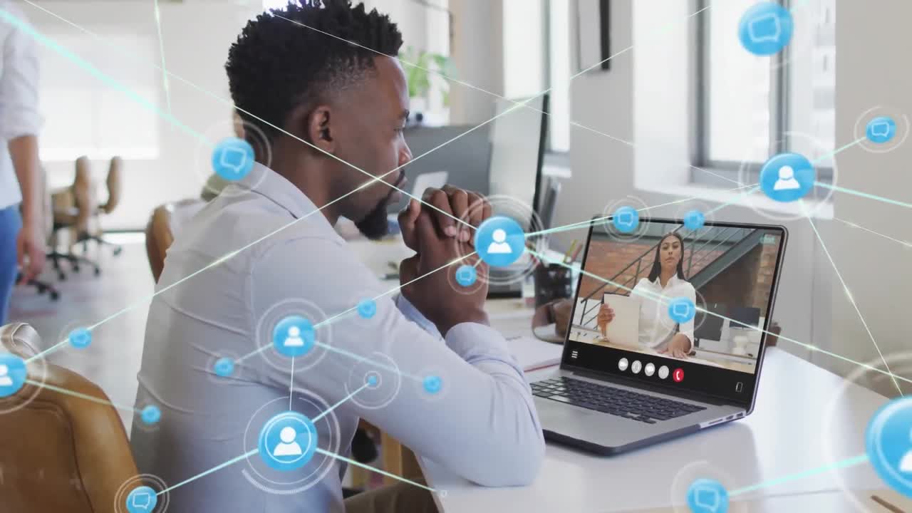 Animation of network of connections with icons over african american businessman in office