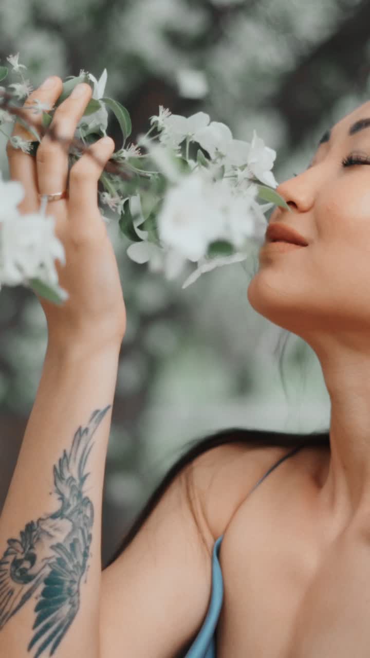 Woman enjoying spring flowers