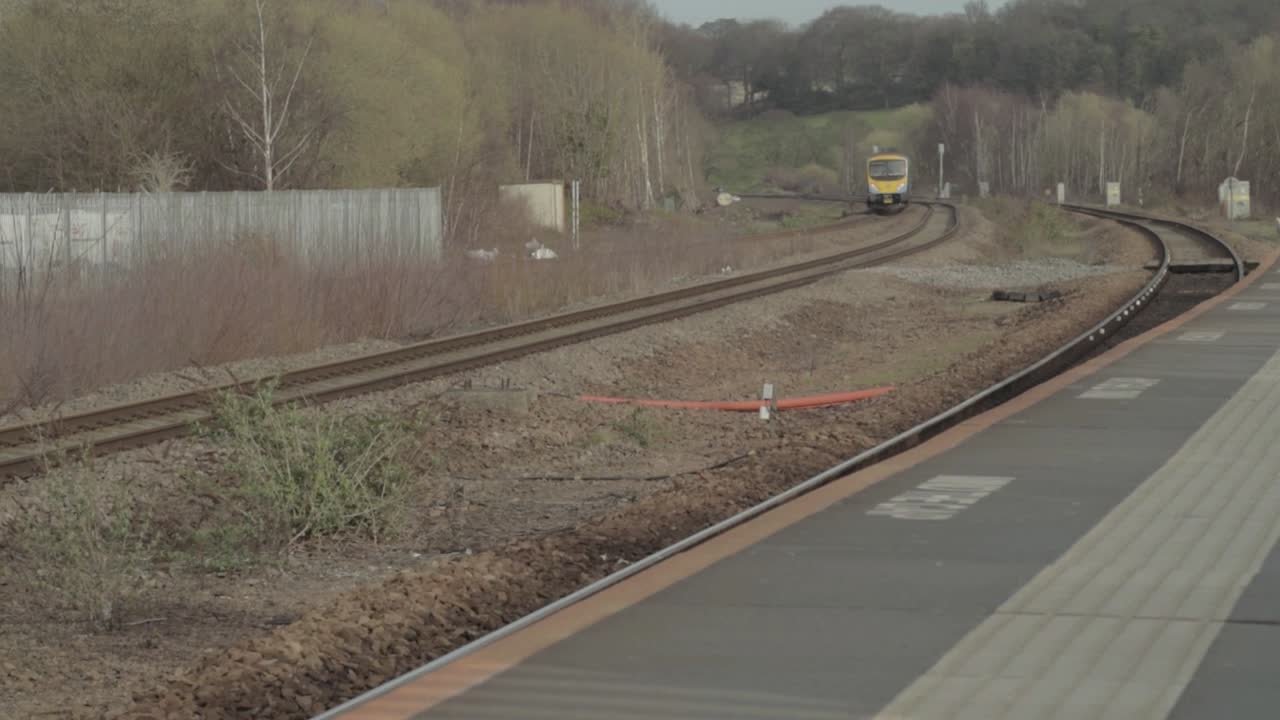 Train approaching an empty railway station
