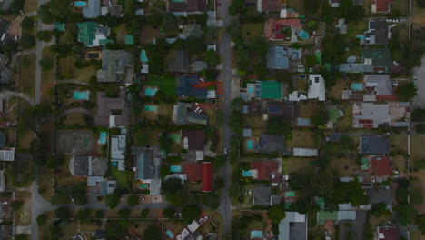 Top-down-footage-of-family-houses-in-residential-neighbourhoods.-Low-buildings-with-gardens-and-swimming-pools.-Port-Elisabeth,-South-Africa