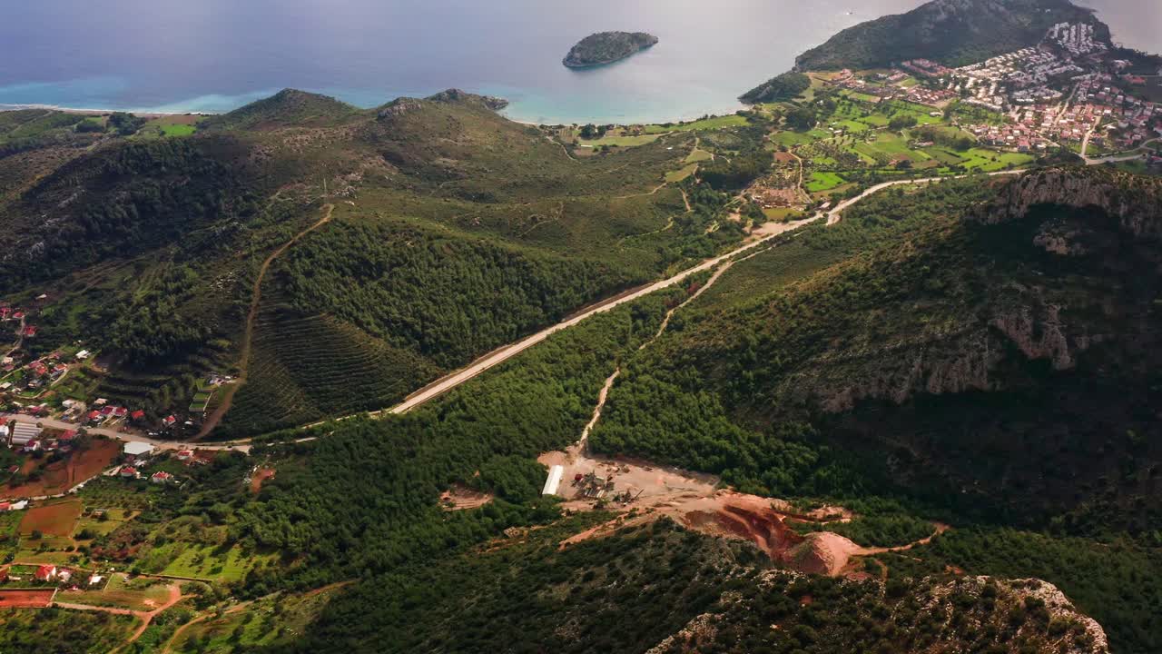 Aerial view of mountain peaks and seaside villages in Turkey, Emecik, Muğla