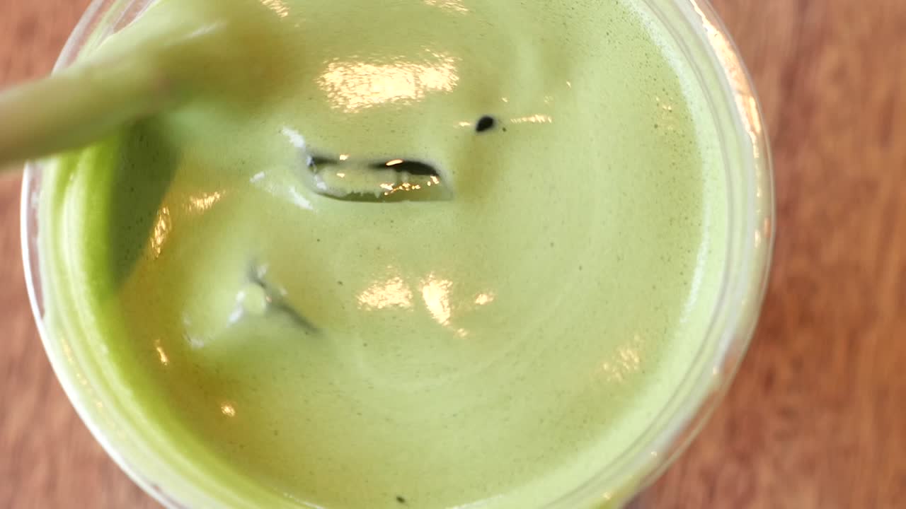 Iced Matcha Drink in a Plastic Cup