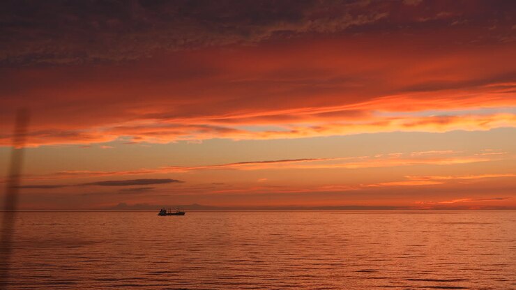 Sunset over the Ocean with a Ship