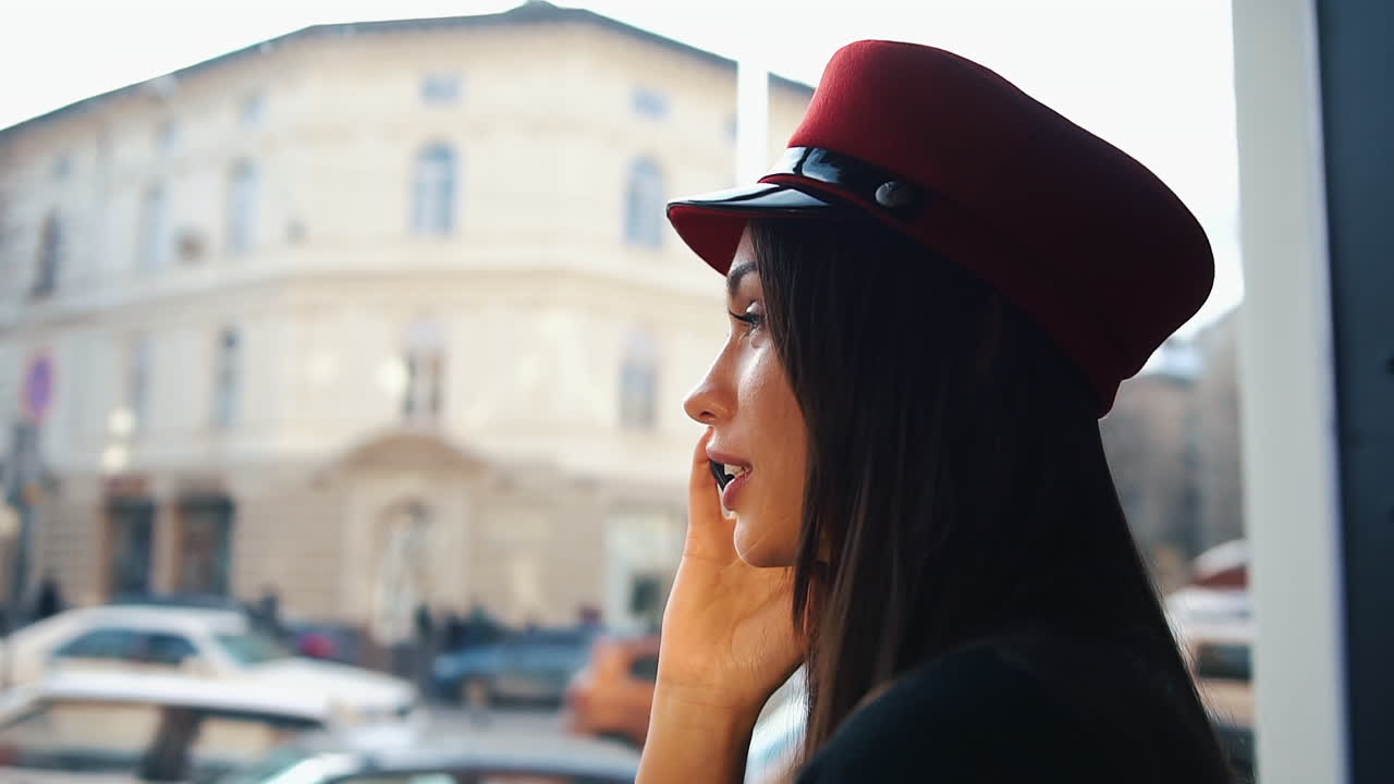 Woman in hat on a phone call