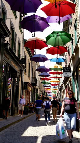 colorful umbrellas in a charming city street
