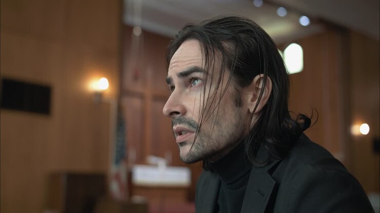 A Christian man, priest, preacher, pastor in spiritual reflection and worship while praying inside old church building, creating a cinematic and contemplative mood