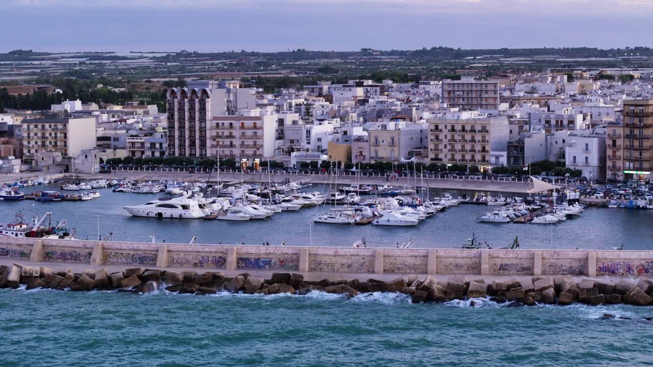 Mola di Bari township and beautiful marina with yachts, aerial view