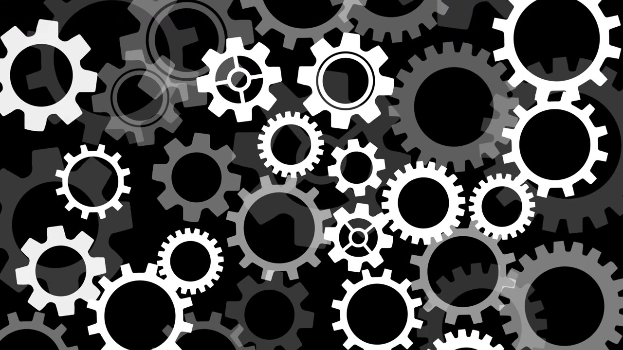 Gray cog wheel industrial visual layered white gears black negative space and mechanical rotation