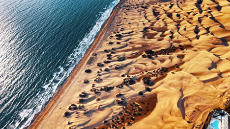 aerial view of gran canaria's sandy coastline and ocean waves