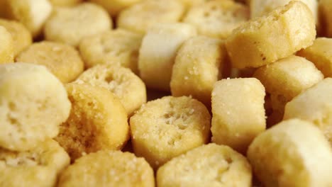 round baked rough crispy croutons. bread rusks. macro