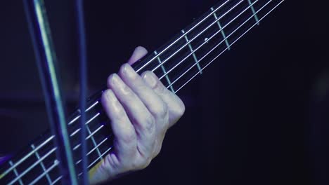closeup-guitarist-hand-smashes-strings