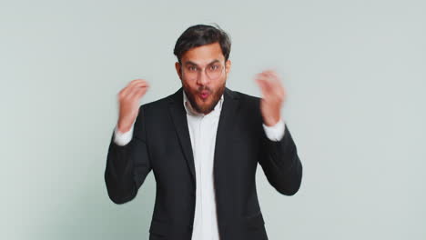businessman touching head and showing explosion looking worried shocked inspiration brainstorm