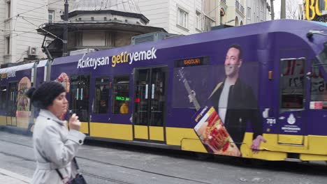 a streetcar travels down a street in istanbul, turkey.