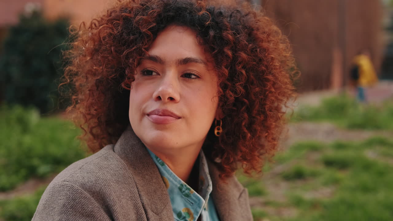 Portrait of a Happy Young Woman in the Park