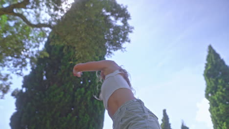 woman dancing in a park