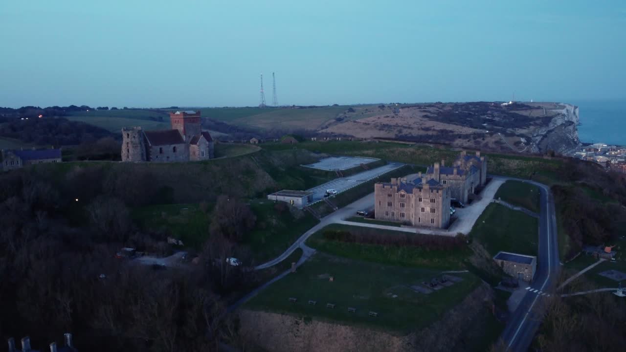 Aerial view of a castle and church on a cliff