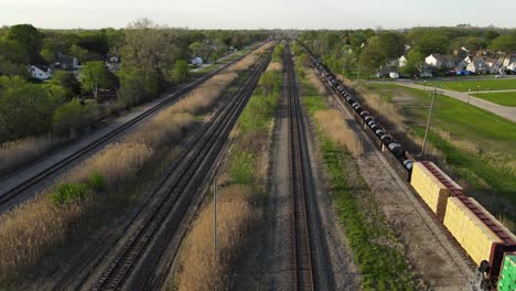 train with steel coils and wood passing through wyandotte, michigan