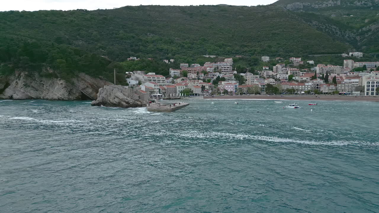 Coastal Cityscape with Sea and Mountains