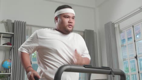 overweight man running on treadmill at home