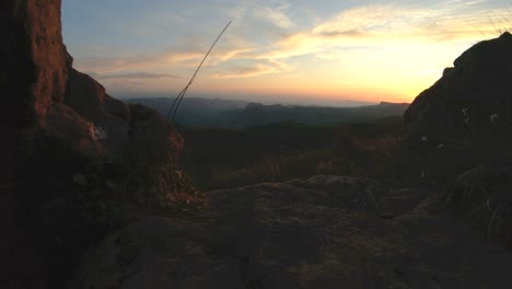 mountain sunset over the peak rock. dark key sunset light in the mountains parallax rocks rock grass