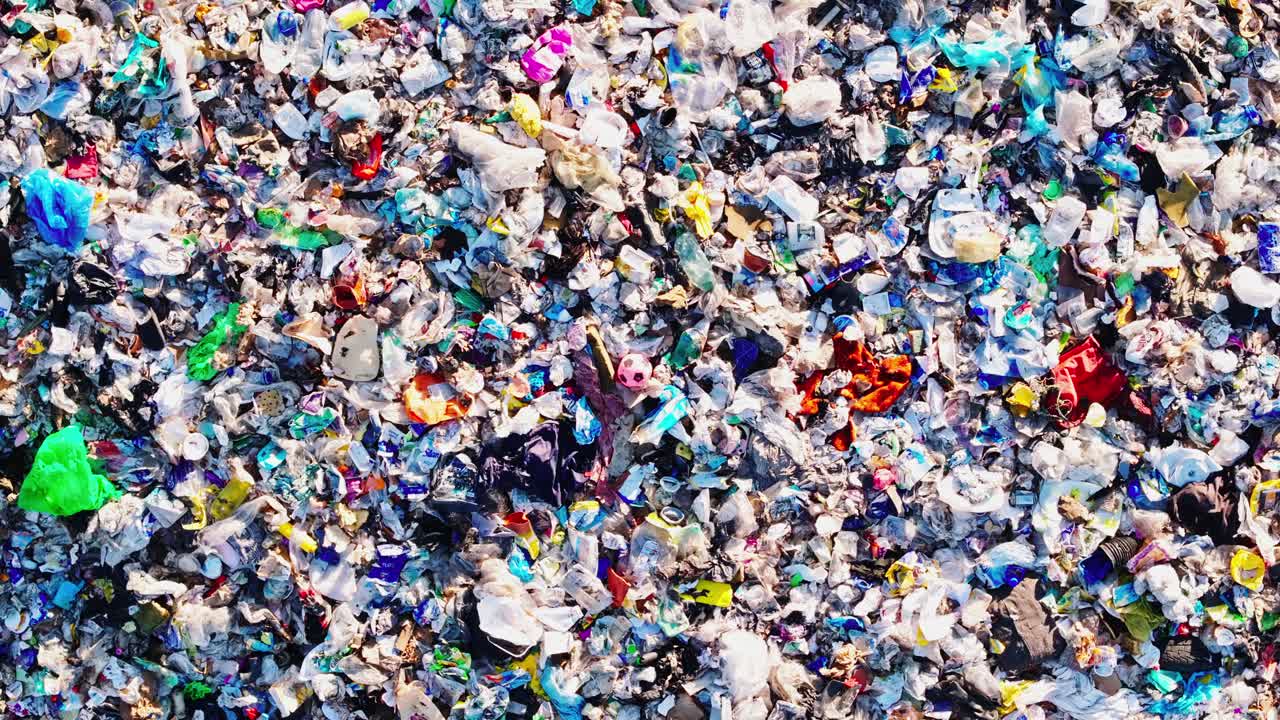 Symbolic cinematic drone footage above landfill, ecosystem collapse - pollution