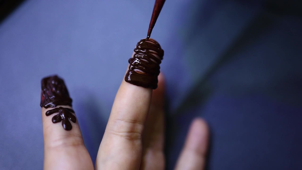 Traditional Mehndi Henna Design Being Applied On Woman Hand