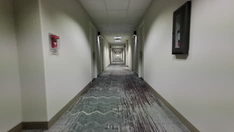 gimbal stabilized trucking shot through nondescript hotel hallway