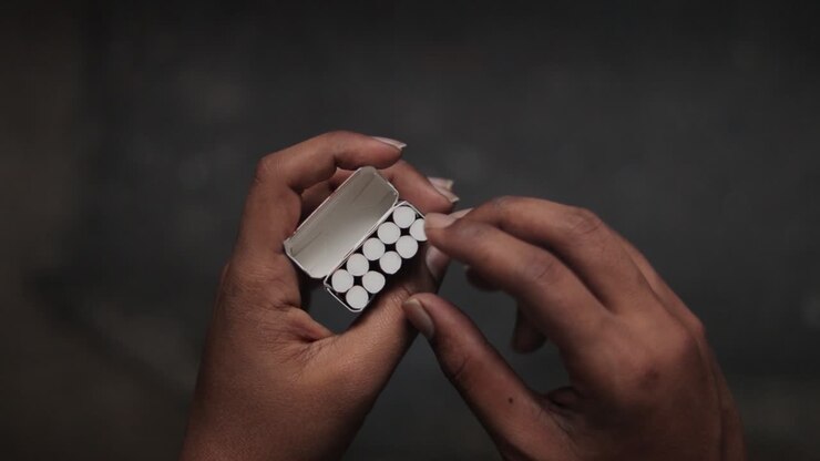 Concept of showing leaving Cigarette addiction in dark room