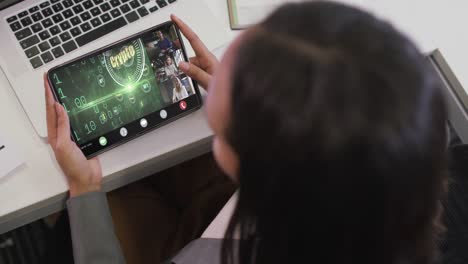 Biracial-businesswoman-using-tablet-for-video-call-with-diverse-business-colleagues