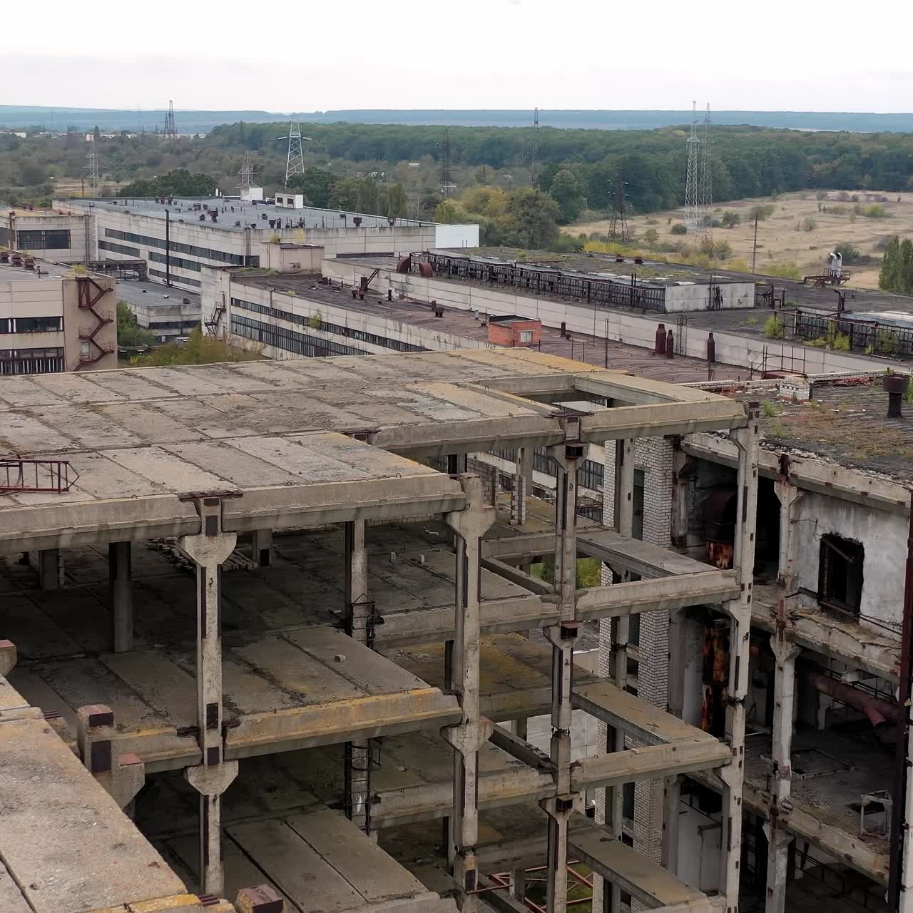 Drone view of old ruined factory. Damaged industry city buildings
