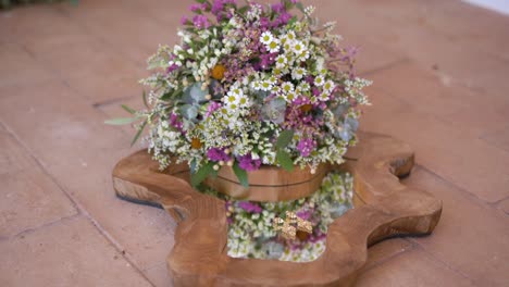 Closeup-shot-of-Colorful-wildflowers-arrangement-on-Wooden-frame-mirror,-Static