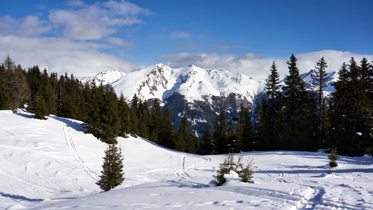 Idyllic winter snow timelapse in the mountains of the alps. View from the slopes of Rosskopf near Sterzing Vipiteno in the Italian alps