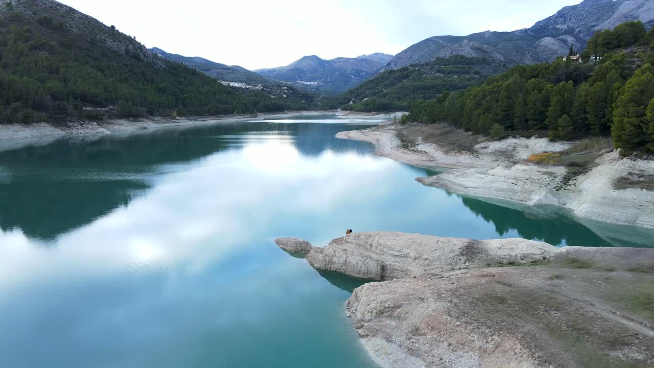 Serene Mountain Lake with Couple