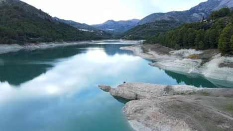 serene mountain lake with couple