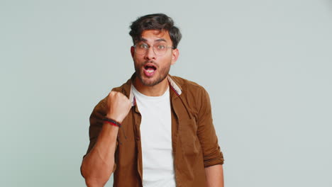 Aggressive-angry-Indian-man-trying-to-fight-at-camera,-shaking-fist,-boxing,-punishment,-threaten