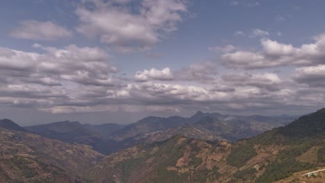 time lapse of a aerial view that shows clouds and mountains