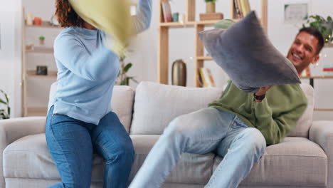 pillow fight, happy couple