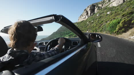 couple driving convertible car cabriolet cape town south africa steadicam shot