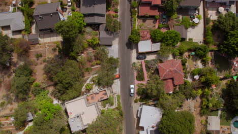 Overhead-aerial-view-of-houses-and-a-street-in-Eagle-Rock-neighborhood-of-Los-Angeles,-California-on-a-pretty-summer-day