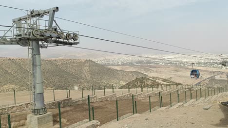 cable car of the aerial tramway connecting oufella peak and agadir city in morocco, overlooking a panoramic view of the beach-18