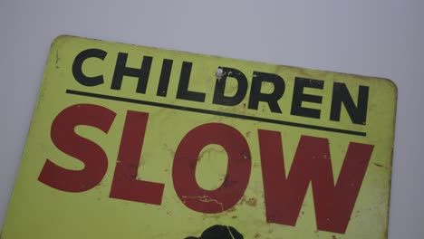 Close-up-footage-of-a-road-sign-that-says-"Children-SLOW