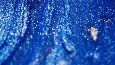 transformation dynamic ink reaction – micro view of abstract energy and bubbles, blue spectrum