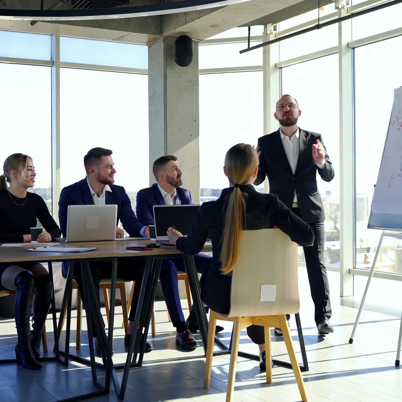 Colleagues employees working in office. Business partners cooperating together at a table. Team of business people meeting in modern office room